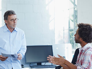 Two security professionals discussing cloud security.